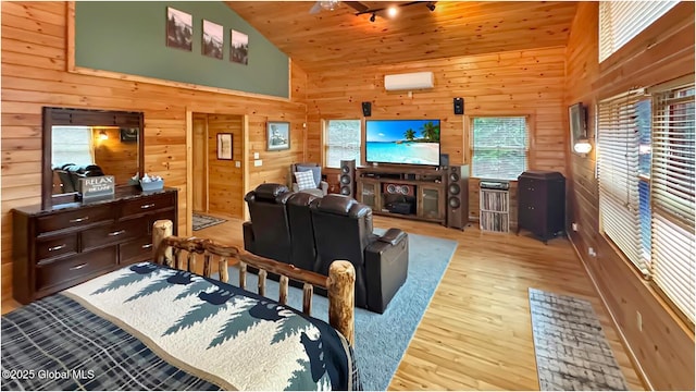 152 Sweenie Fields Rd, Schroon Lake, NY 12870 - bedroom with light wood finished floors, multiple windows, wood walls, and high vaulted ceiling