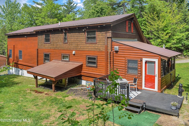 152 Sweenie Fields Rd, Schroon Lake, NY 12870 - rear view of property featuring a deck, a lawn, and metal roof