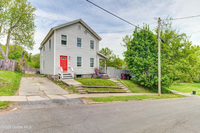 6 William St, Gloversville, NY 12078 - view of front of house with entry steps, fence, and concrete driveway