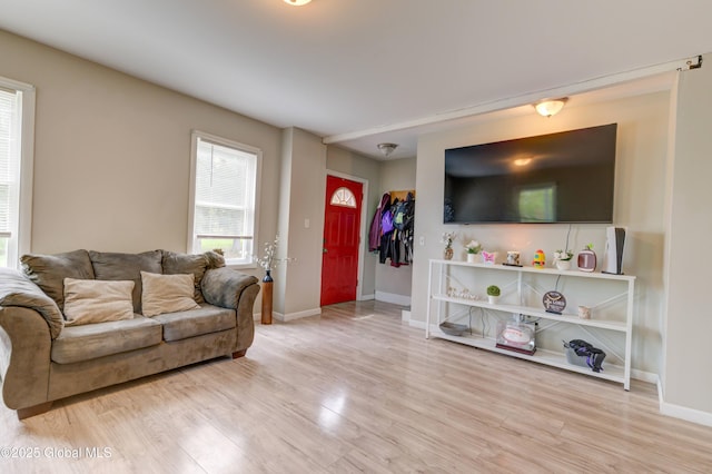 6 William St, Gloversville, NY 12078 - living area featuring light wood-style floors and baseboards