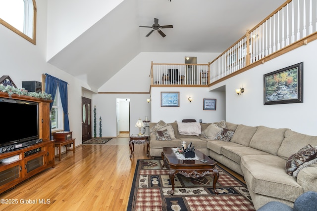 19 Karen St, Warrensburg, NY 12885 - living room featuring high vaulted ceiling, light wood finished floors, and a ceiling fan