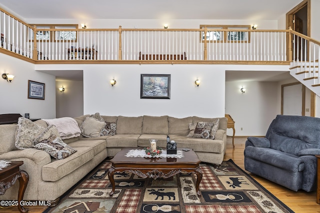 19 Karen St, Warrensburg, NY 12885 - living room with a towering ceiling, wood finished floors, and stairway