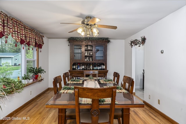 19 Karen St, Warrensburg, NY 12885 - dining space featuring a ceiling fan, light wood-style floors, and baseboards
