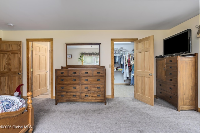 19 Karen St, Warrensburg, NY 12885 - bedroom with light colored carpet, a spacious closet, a closet, and baseboards