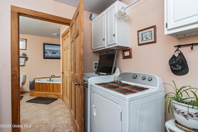19 Karen St, Warrensburg, NY 12885 - laundry room with washing machine and clothes dryer, cabinet space, and light tile patterned flooring