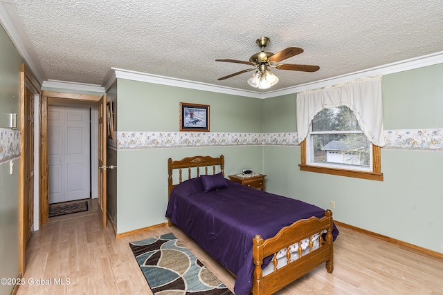 19 Karen St, Warrensburg, NY 12885 - bedroom featuring wood finished floors, a textured ceiling, crown molding, and baseboards