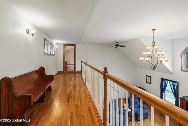 19 Karen St, Warrensburg, NY 12885 - hallway featuring a chandelier, plenty of natural light, and light wood-type flooring