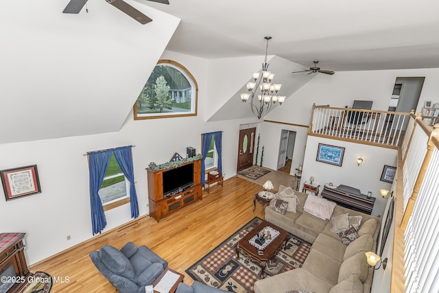 19 Karen St, Warrensburg, NY 12885 - living area with a ceiling fan, wood finished floors, lofted ceiling, a chandelier, and healthy amount of natural light
