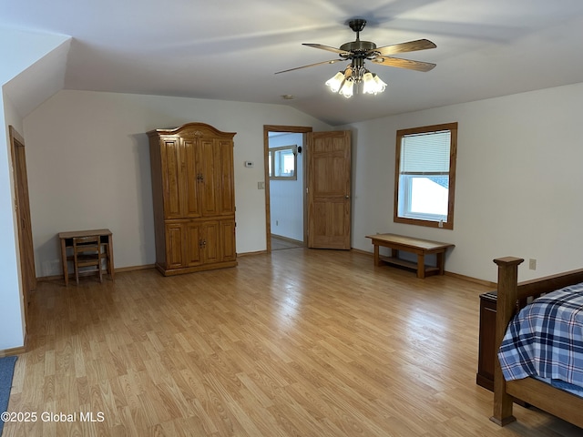 19 Karen St, Warrensburg, NY 12885 - unfurnished bedroom with light wood finished floors, lofted ceiling, baseboards, and ceiling fan