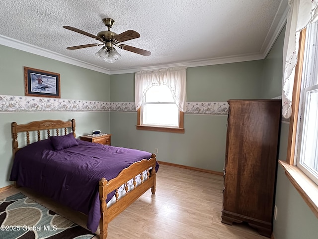 19 Karen St, Warrensburg, NY 12885 - bedroom featuring multiple windows, light wood-type flooring, a textured ceiling, crown molding, and ceiling fan