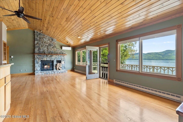 31 Fish Point Rd, Bolton, NY 12824 - unfurnished living room featuring a baseboard heating unit, wood ceiling, a fireplace, a ceiling fan, and wood finished floors