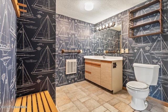 31 Fish Point Rd, Bolton, NY 12824 - half bath with wallpapered walls, a textured ceiling, toilet, and vanity
