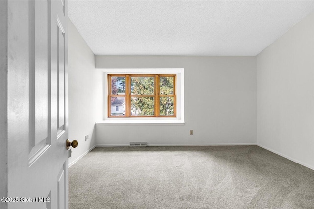10 Tiffany Dr, Queensbury, NY 12804 - carpeted empty room featuring a textured ceiling and baseboards