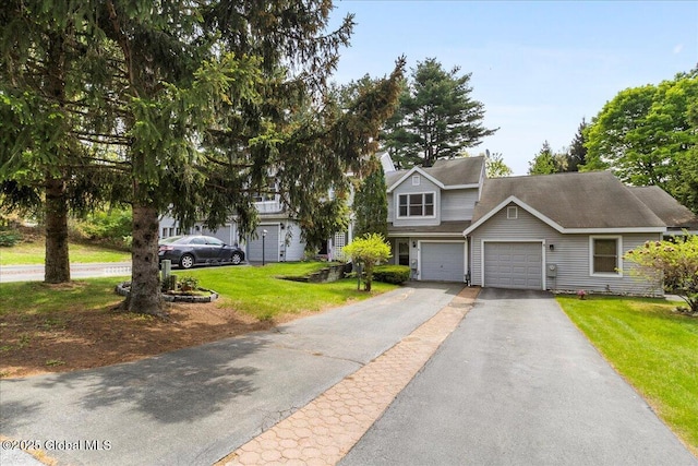 10 Tiffany Dr, Queensbury, NY 12804 - view of front facade featuring asphalt driveway, a front lawn, and a garage