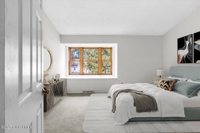 10 Tiffany Dr, Queensbury, NY 12804 - bedroom featuring light colored carpet and a textured ceiling