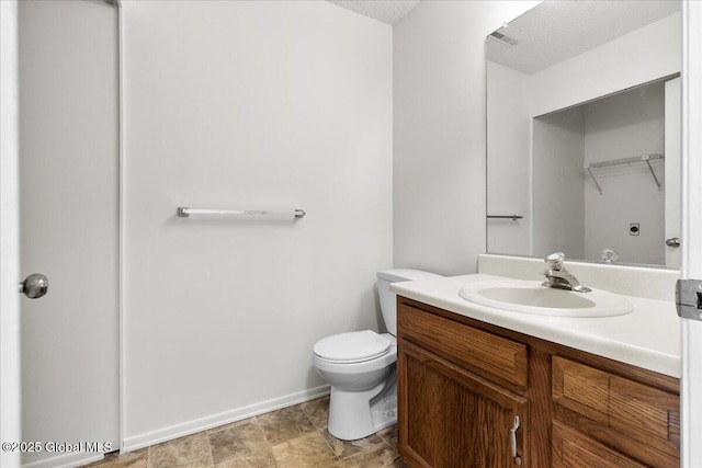 10 Tiffany Dr, Queensbury, NY 12804 - bathroom with vanity, toilet, and baseboards