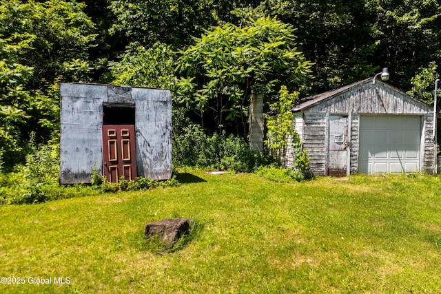 4474 State Highway 5, Fonda, NY 12068 - view of green lawn featuring an outdoor structure and a garage