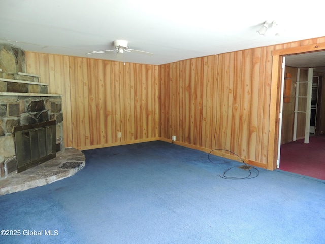30 Prospect St, Warrensburg, NY 12885 - unfurnished living room with carpet flooring, a ceiling fan, and wood walls