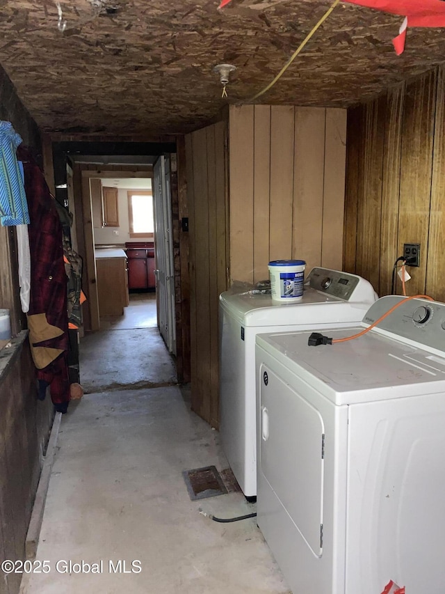 30 Prospect St, Warrensburg, NY 12885 - laundry room featuring washer and clothes dryer and wooden walls