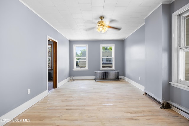9 Archibald St, Colonie, NY 12189 - unfurnished room featuring radiator, crown molding, ceiling fan, light wood finished floors, and baseboards