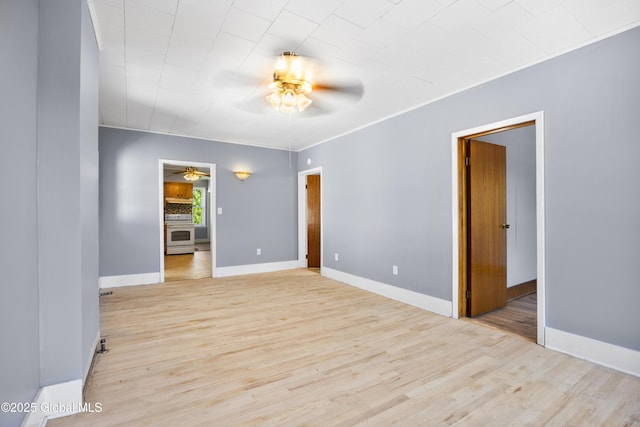 9 Archibald St, Colonie, NY 12189 - empty room with a ceiling fan, light wood finished floors, and baseboards