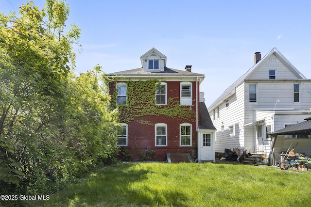 9 Archibald St, Colonie, NY 12189 - rear view of property featuring brick siding, a yard, and a gazebo