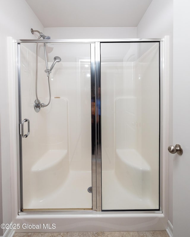bathroom with a shower stall