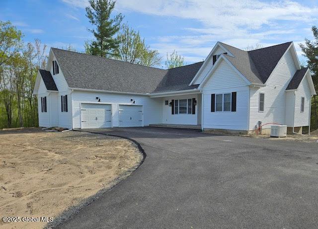 273 N Mansion Rd, Duanesburg, NY 12056 - view of front of house with a garage, cooling unit, and asphalt driveway