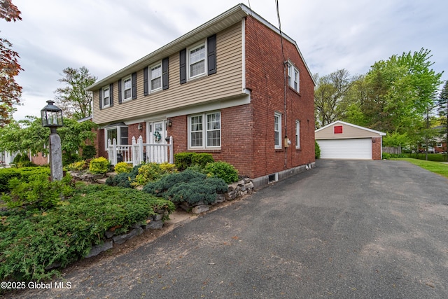 76 Mcnutt Ave, Colonie, NY 12205 - colonial home featuring a garage, brick siding, and an outdoor structure