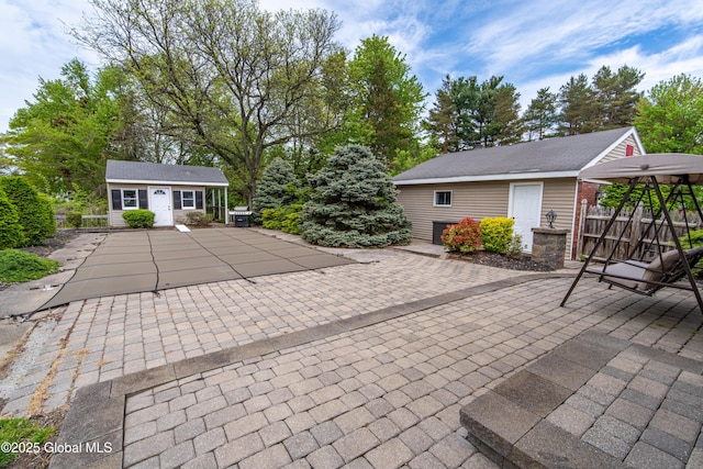 76 Mcnutt Ave, Colonie, NY 12205 - view of patio featuring an outbuilding and a covered pool