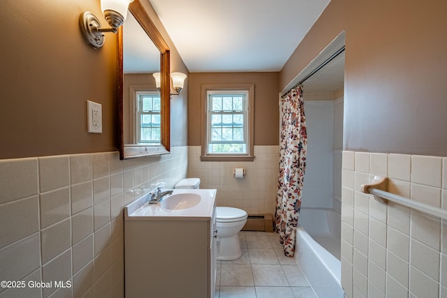 76 Mcnutt Ave, Colonie, NY 12205 - bathroom with tile walls, toilet, tile patterned flooring, vanity, and wainscoting