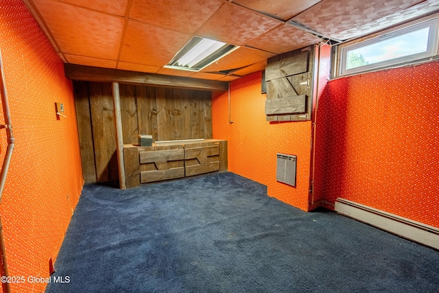 76 Mcnutt Ave, Colonie, NY 12205 - basement with baseboard heating, carpet flooring, and wood walls