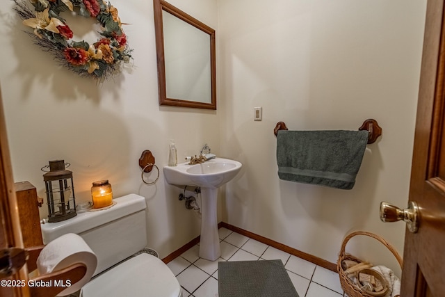 76 Mcnutt Ave, Colonie, NY 12205 - bathroom with toilet, baseboards, and tile patterned floors