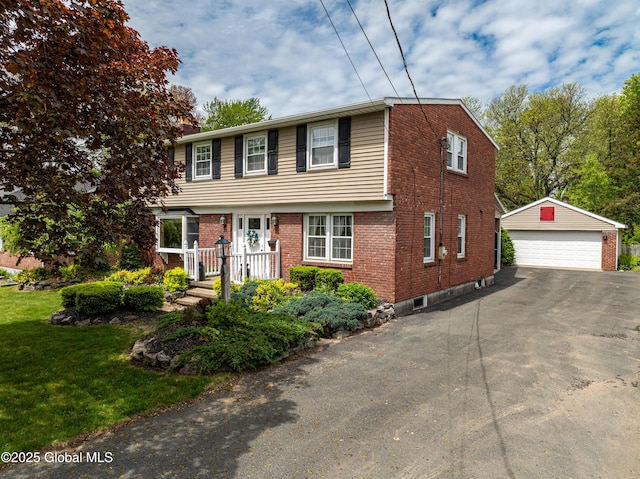 76 Mcnutt Ave, Colonie, NY 12205 - colonial house with a garage, brick siding, an outdoor structure, and a front lawn