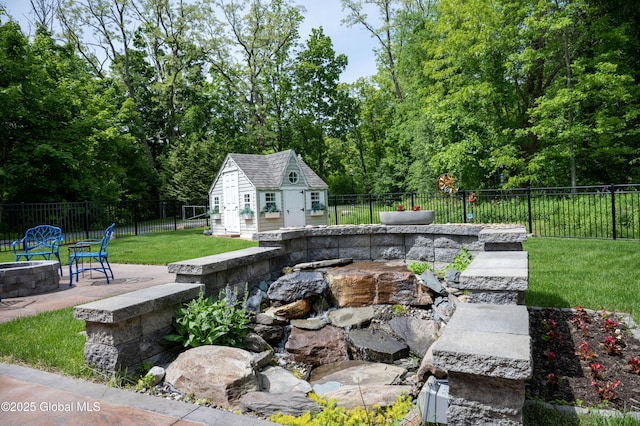49 N Village Cir, Round Lake, NY 12151 - view of yard featuring a fire pit, an outbuilding, and a patio
