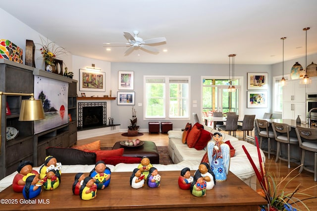 49 N Village Cir, Round Lake, NY 12151 - living room featuring a ceiling fan, a tile fireplace, recessed lighting, and wood finished floors