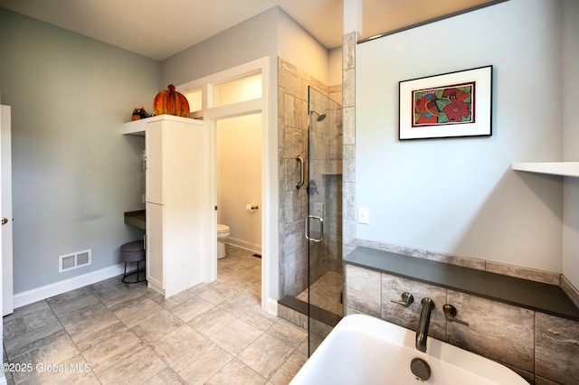 49 N Village Cir, Round Lake, NY 12151 - full bathroom with a freestanding bath, toilet, a shower stall, and a sink