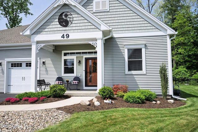 49 N Village Cir, Round Lake, NY 12151 - view of front facade featuring an attached garage and a porch