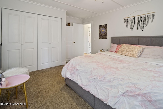 carpeted bedroom featuring a closet and crown molding