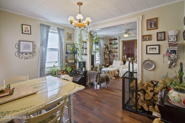 1506 5th Ave, Watervliet, NY 12189 - dining space with crown molding, a chandelier, dark wood-style flooring, built in features, and ceiling fan