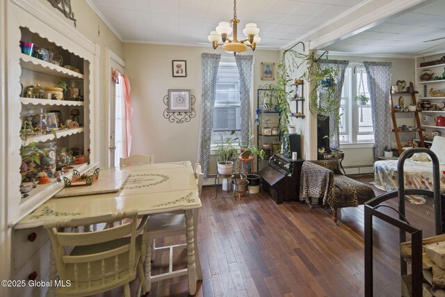 1506 5th Ave, Watervliet, NY 12189 - dining room featuring crown molding, a chandelier, dark wood-style flooring, and a baseboard radiator