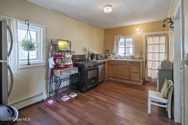 1506 5th Ave, Watervliet, NY 12189 - kitchen featuring stainless steel appliances, baseboard heating, a sink, and dark wood-style floors