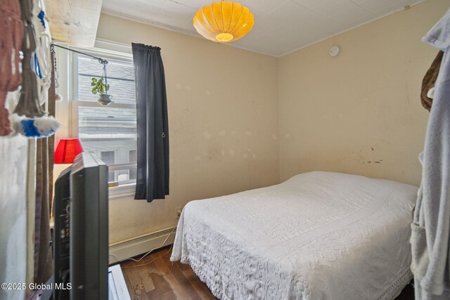 1506 5th Ave, Watervliet, NY 12189 - bedroom featuring multiple windows and wood finished floors