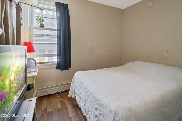 1506 5th Ave, Watervliet, NY 12189 - bedroom with multiple windows and wood-type flooring