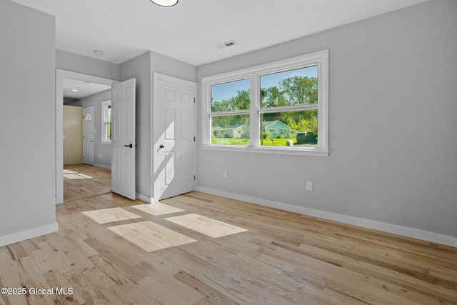 12 Jones Dr, Colonie, NY 12309 - unfurnished bedroom with wood finished floors and baseboards