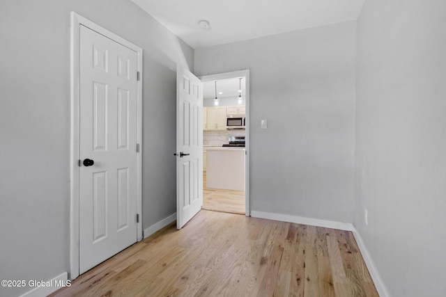 12 Jones Dr, Colonie, NY 12309 - unfurnished bedroom featuring light wood-style flooring