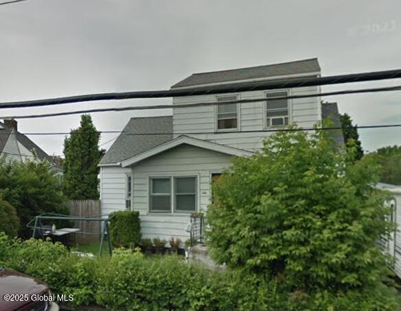 view of side of property featuring fence