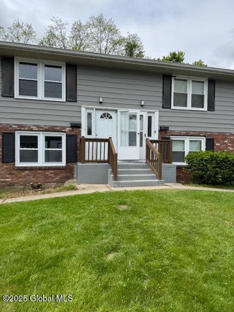 3 Loralee Dr, Colonie Village, NY 12205 - raised ranch with brick siding and a front yard