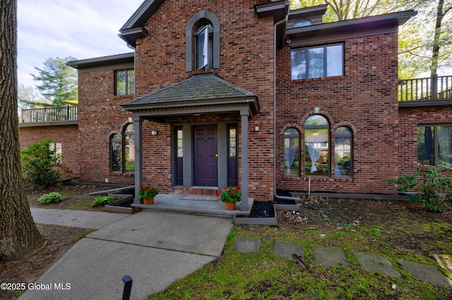 view of front of house featuring brick siding