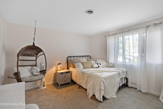 bedroom with light carpet